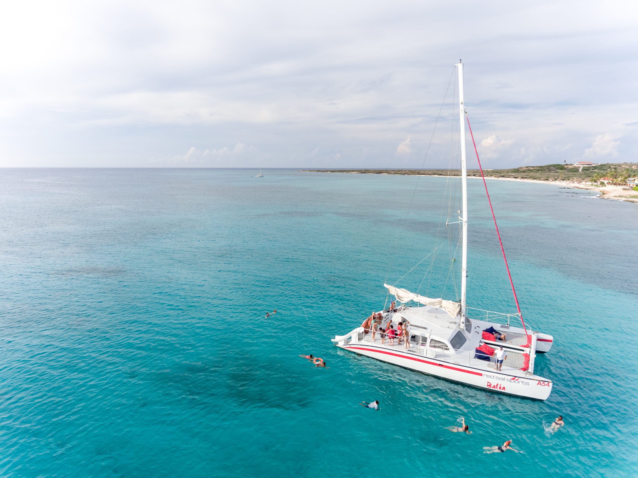 Catamaran stopping so guests can swim.